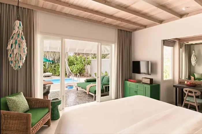 The overwater half of a split stay — villas above the lagoon
