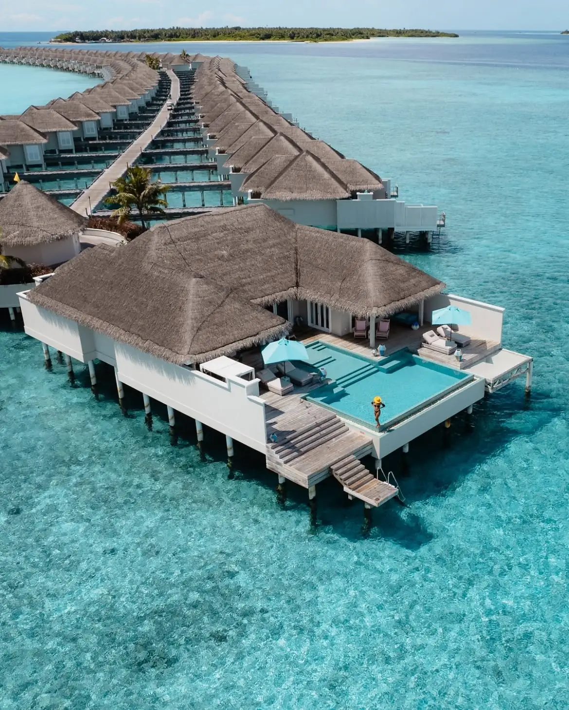 Family enjoying Finolhu Maldives' children's activities and family facilities.