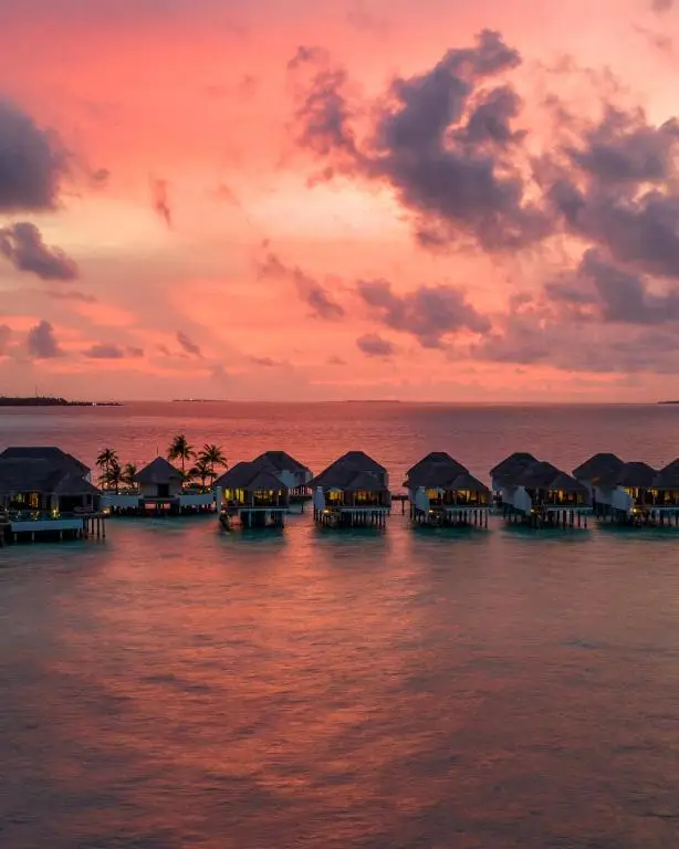 Sunset at Finolhu Baa Atoll Maldives, the perfect setting to plan your stay with Zaha Travels.