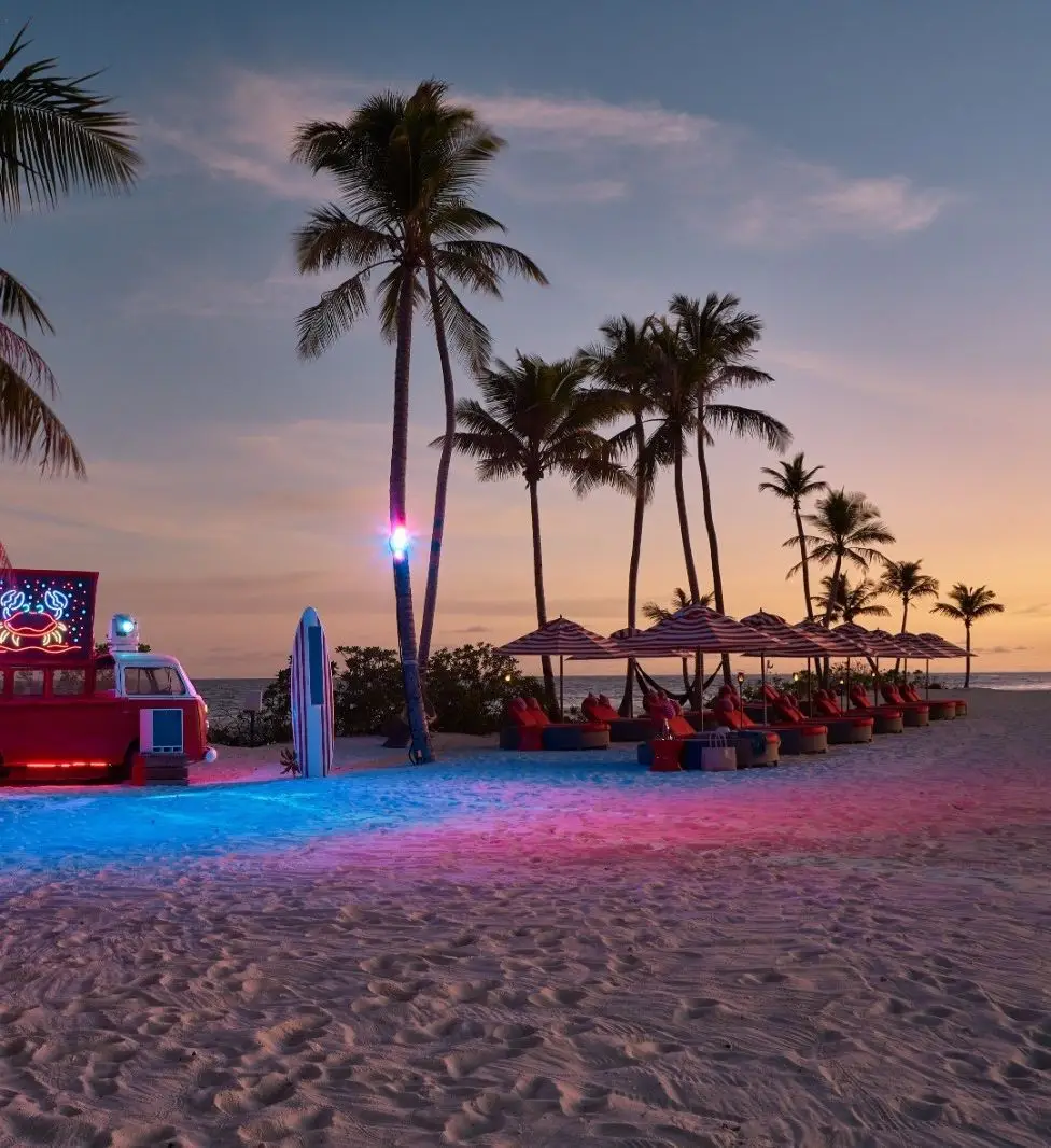 Beach area at Finolhu Maldives with bold colours and playful design details.