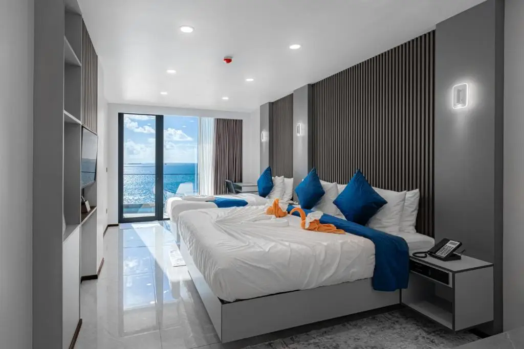 iCom Blue Sea View — Deluxe Family Room with Balcony & Sea View